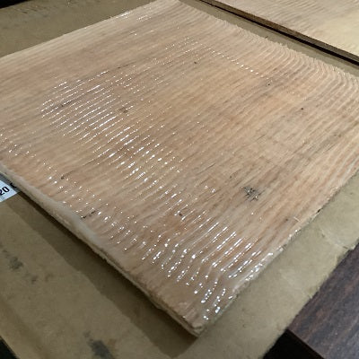 Thick epoxy is used to glue Filon fiberglass RV siding to plywood